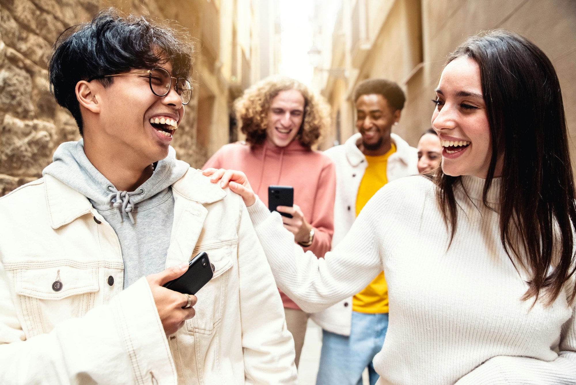 Multiracial friends hanging out in city center together