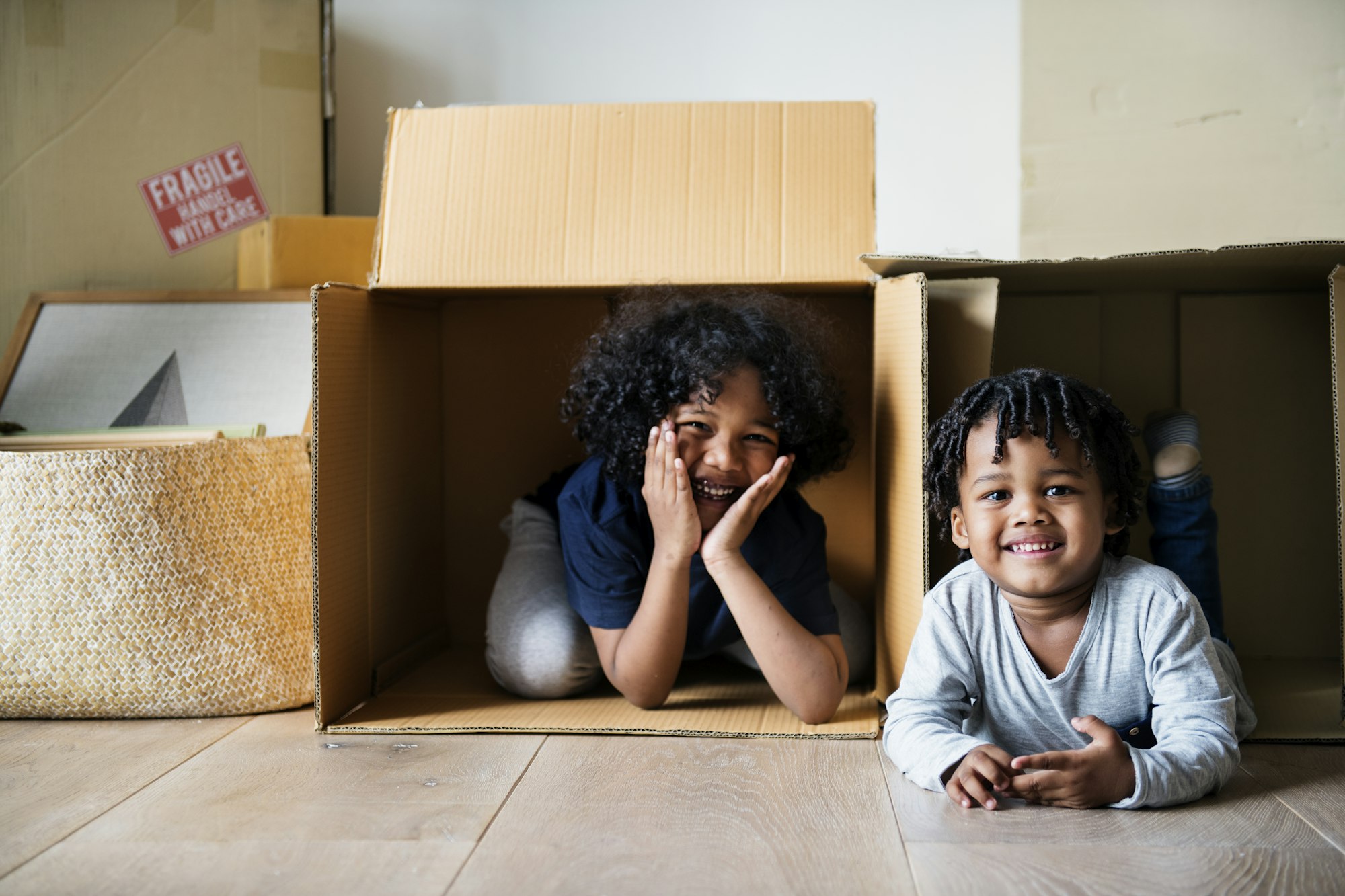 Young African kids moving to new house