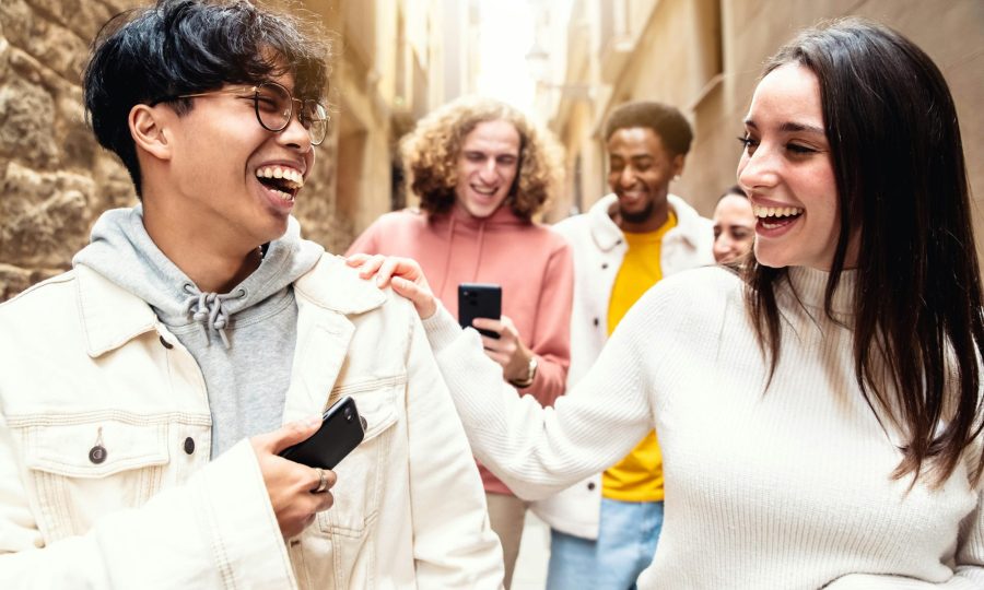 Multiracial friends hanging out in city center together